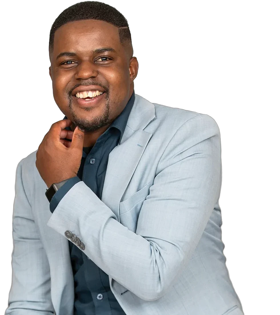 Andrew Tsuro smiling in a light blue suit